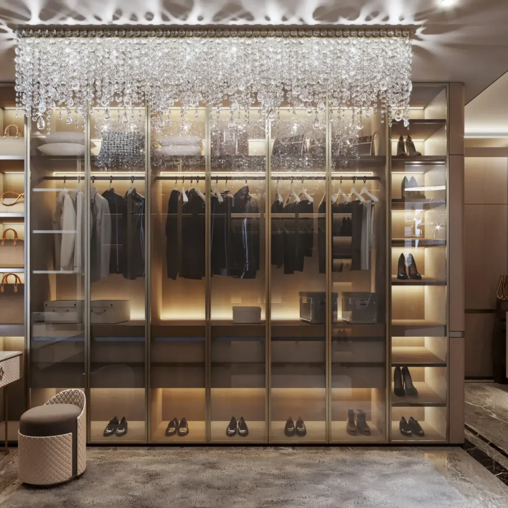A luxurious walk-in closet featuring a chandelier and a full-length mirror, showcasing elegant storage and lighting.