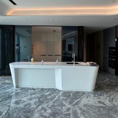 Modern-kitchen-with-a-sleek-white-island-and-marble-floor-dubai