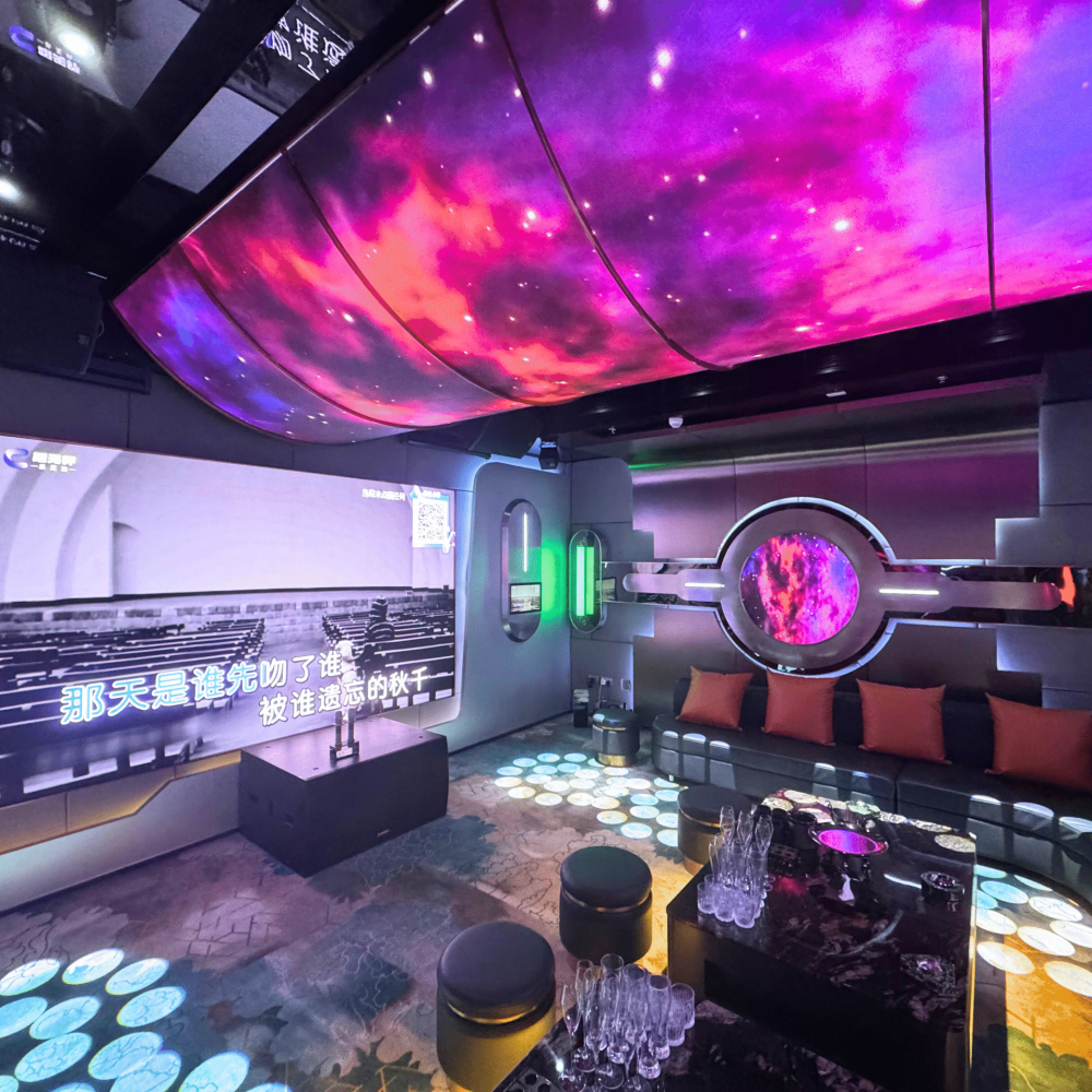 well lit entertainment area with karaoke room with big screen and decent lighting